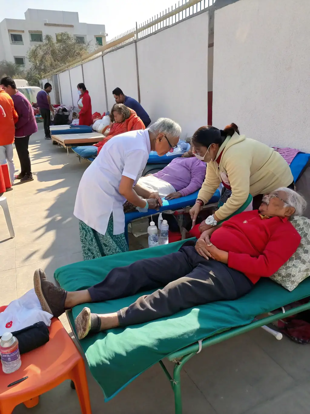 A heartwarming image of volunteers assisting at an ECURIE DES BALZANES event, highlighting the organization's commitment to community involvement and support.